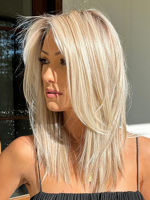Jenna wearing SHOW STOPPER by RAQUEL WELCH in RL19/23SS SHADED BISCUIT | Light Ash Blonde Evenly Blended with Cool Platinum Blonde and Dark Roots