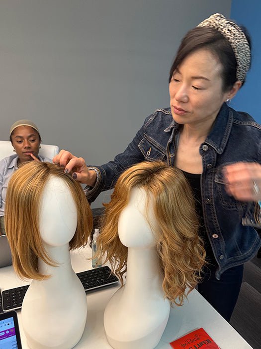 Wig Designer Grace styling an Estetica wig on a mannequin head