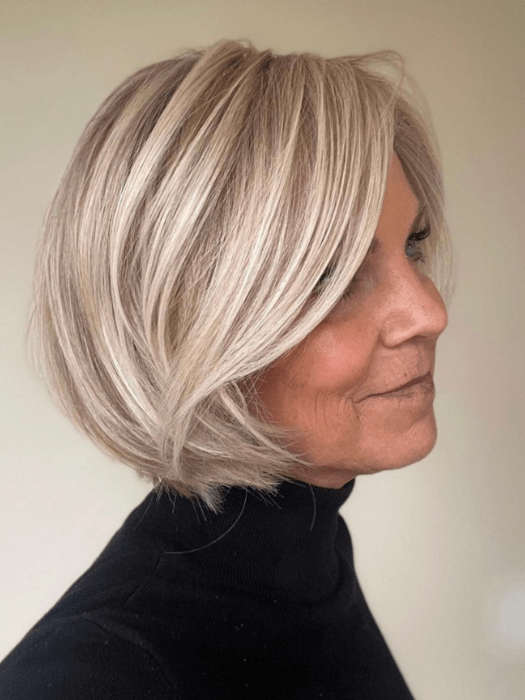 Susan Sparks @sparkles_intheworld wearing STRAIGHT UP WITH A TWIST by RAQUEL WELCH WIGS in color RL19/23SS SHADED BISCUIT | Cool Platinum blonde with subtle highlights and medium brown roots