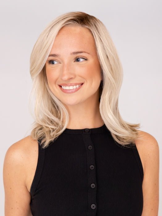 Model is wearing DAZZLING WAVEZ by RENE OF PARIS in color MILKY OPAL R | A Blend of Creamy Blonde and White Blonde Rooted with Warm Brown