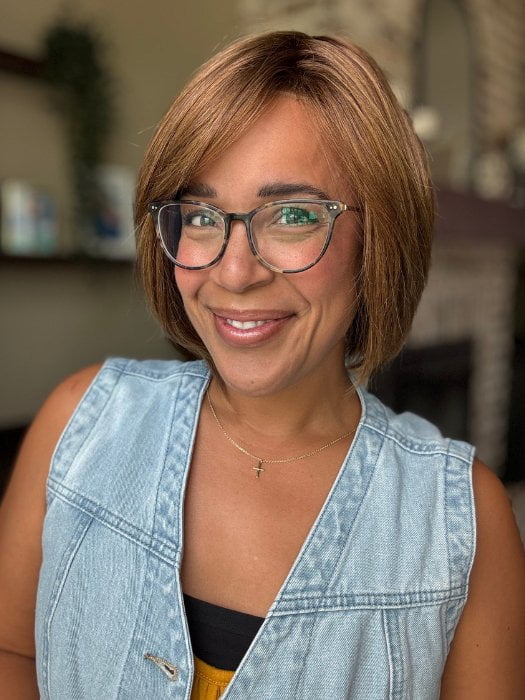 Brea wearing JADORE DELUXE by ELLEN WILLE in CHOCOLATE-ROOTED | Medium to Dark Brown base with Light Reddish Brown highlights and Dark Roots
