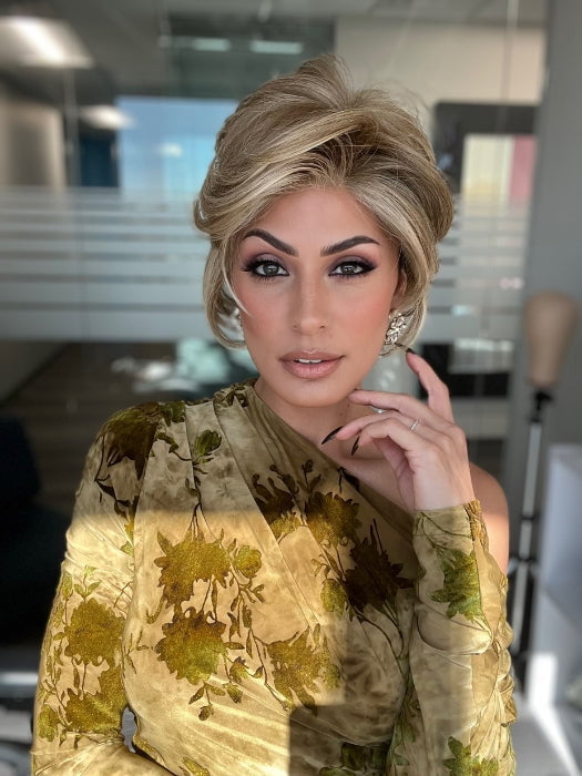 ROXIE wearing CAPTIVATING CANVAS by RAQUEL WELCH in RL13/88 Golden Pecan | Neutral Medium Blonde With Pale Honey Blonde Highlights