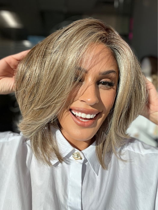 Roxie wearing ALWAYS TRENDING by RAQUEL WELCH inSS12/22 SHADED CAPPUCCINO | Light Golden Brown Evenly Blended with Cool Platinum Blonde Highlights with Dark Roots