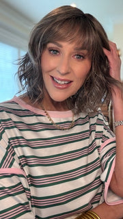 Eileen wearing TERRA by AMORE in BRONDE-R | Dark brown and natural medium blond tones are mixed together and shaded with medium dark brown roots for a realistic appearance.