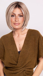 Roxie wearing BECKHAM by BELLETRESS in BUTTERCAKE BLONDE-R | A neutral-warm blonde blend featuring light brown, ash, and lightest blonde tones with natural-looking darker roots for added depth and realism.