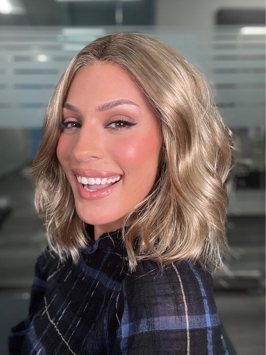 ROXIE wearing Charlotte Petite by ENVY  in SAHARA BLONDE | Softer Dark Blonde with Light Golden Blonde, and features Chestnut Roots