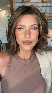 Madeline wearing FERRARI by BELLETRESS in CHOCOLATE BUTTERCREAM R | Medium and Dark Brown Rooted with a Blend of Medium Brown and Dark Blonde