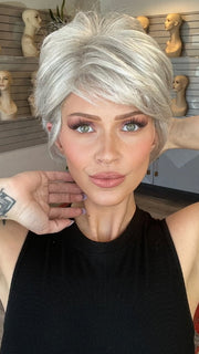 Madeline wearing SPARKLE by RAQUEL WELCH in R56/60 SILVER MIST | Lightest Gray with 20% Medium Brown Evenly Blended with Pure White