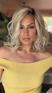 Roxie wearing BRADSHAW by BELLETRESS in MILKSHAKE BLONDE R | A mixture of Light Sandy Brown, Highlighted with Light Ash Blonde with a Hint of Light Platinum Blonde with a Medium Root Color