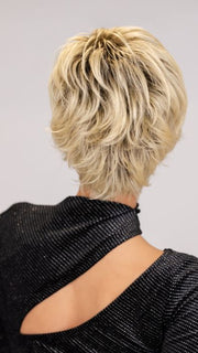 ROXIE wearing SPARKLE ELITE by RAQUEL WELCH in SS613 SHADED PLATINUM | Dark Brown Roots with Warm Platinum Blonde
