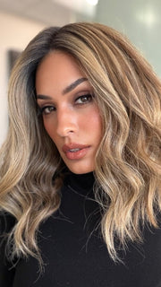 Model is wearing COREY by ENVY in color HONEY BREEZE | A blend of Cool, Honey Blonde and Multi-Dimensional Medium Brown with Darker Brown Roots