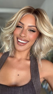 Roxie wearing STEAL THE SHOW by RAQUEL WELCH in SS19/23 SHADED BISCUIT | Cool Platinum Blonde with subtle highlights and Medium Brown roots