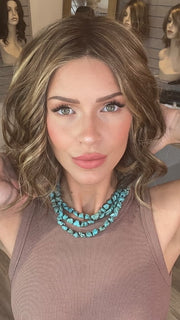 Madeline wearing SPADE by BELLETRESS in TOASTED WALNUT R | Medium Brown Rooted, Ash Brown, Medium Gold Blonde, and Light Brown Blended to perfection