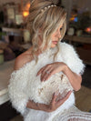 Roxie wearing KELLY by BELLETRESS in BUTTERCAKE BLONDE-R | A neutral-warm blonde blend featuring light brown, ash, and lightest blonde tones with natural-looking darker roots for added depth and realism.
