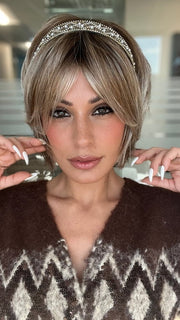 ROXIE wearing ZEAL by NORIKO in MELTED-MARSHMALLOW | Subtly Warm Dark Sandy Blonde Blend with Medium Brown Roots and Light Ash Blonde Tips and Highlights