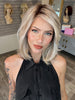 Madeline wearing PARK AVE by BELLETRESS in MILKSHAKE BLONDE R | A mixture of Light Sandy Brown, Highlighted with Light Ash Blonde with a Hint of Light Platinum Blonde with a Medium Root Color