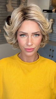 Madeline wearing ROMA by BELLETRESS in RAW SUGAR BLONDE | A Neutral Light Blonde, Honey Blonde, Pale Gold Blonde, with a base of Light Brown Lowlights featuring a Medium Root Color