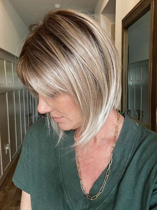 Jenny B. @thewiggygirl wearing ALVA by NORIKO in color MELTED-MARSHMALLOW | Subtly Warm Dark Sandy Blonde Blend with Medium Brown Roots and Light Ash Blonde Tips and Highlights