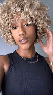 Seairra @seairrairving_ wearing ANIYAH by KIM KIMBLE in color MC25-88SS HONEY | Beige Blonde with a Darker Root