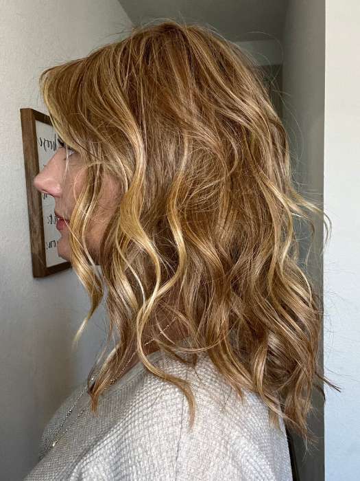 Jenny B. @thewiggygirl wearing BEACH WAVE MAGIC by TRESSALLURE in color 14/26/R10 | Red Blonde with Gold Blonde highlights and Light Brown roots