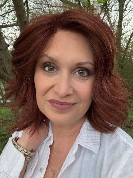 Emily Herrin @she_sheds_more wearing UNFILTERED by RAQUEL WELCH WIGS in color RL33/35 DEEPEST RUBY | Dark Auburn Evenly Blended with Ruby Red
