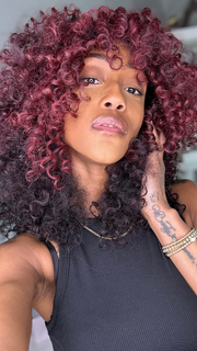 Seairra @seairrairving_ wearing MAKAYALA by KIM KIMBLE in color MC4/35SS SANGRIA | Dark Rooted Red with Fiery Red Highlights