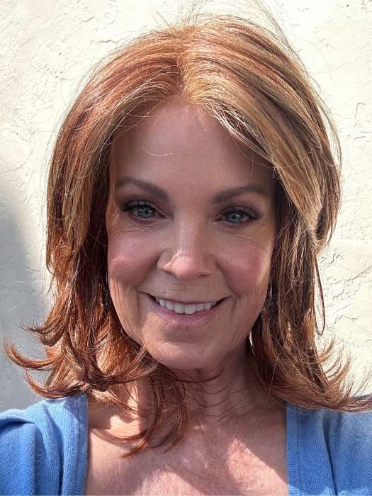 Susan Sparks @sparkles_intheworld wearing GODDESS by RAQUEL WELCH WIGS in color RL31/29 FIERY COPPER | Medium Light Auburn Evenly Blended with Ginger Blonde