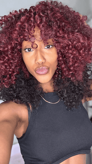 Seairra @seairrairving_ wearing MAKAYALA by KIM KIMBLE in color MC4/35SS SANGRIA | Dark Rooted Red with Fiery Red Highlights