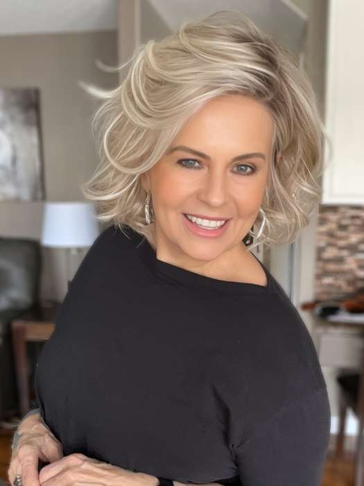 Donna @style.me.ageless wearing FLIRT ALERT by RAQUEL WELCH WIGS in color RL19/23SS SHADED BISCUIT | Light Ash Blonde Evenly Blended with Cool Platinum Blonde with Dark Roots