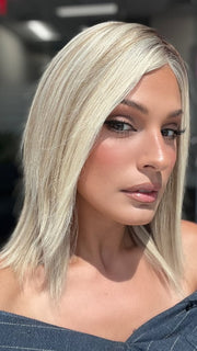 Roxie wearing CARRIE PETITE by JON RENAU in 101/88/27S8 CATALINA BLONDE | Pale blonde with Pure White Natural Violet halo highlights, shaded medium brown 