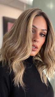 Model is wearing COREY by ENVY in color HONEY BREEZE | A blend of Cool, Honey Blonde and Multi-Dimensional Medium Brown with Darker Brown Roots