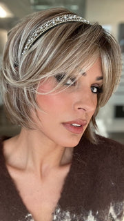 ROXIE wearing ZEAL by NORIKO in MELTED-MARSHMALLOW | Subtly Warm Dark Sandy Blonde Blend with Medium Brown Roots and Light Ash Blonde Tips and Highlights