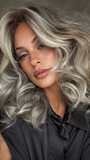 Roxie wearing MILLION DOLLAR BABE by TRESSALLURE in 52/38/49/R8 | 3 Tones of Grey blended with Dark Brown Roots