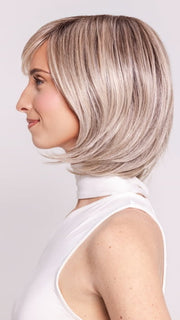 Ava wearing WINTOUR by BELLETRESS in COOL CHAI BLONDE-R | A balanced cool blonde with softly contrasted darker roots, a fresh twist on classic blonde tones.