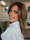 Roxie is wearing FENIX by ESTETICA in color CKISSRT4 | Golden Brown with Copper Blonde Highlights & Dark Brown Roots