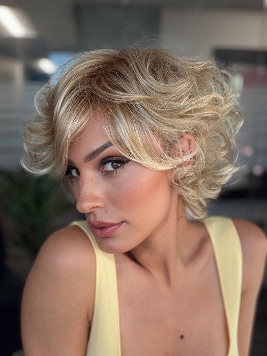 Roxie is wearing BOUYANT by GABOR in GL14-22SS SS SANDY BLONDE | Dark golden blonde base blends into multi-dimensional tones of medium gold blonde and light beige blonde