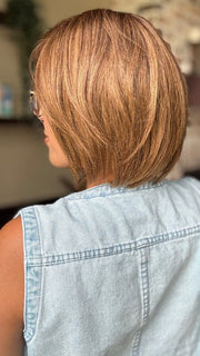 Brea wearing JADORE DELUXE by ELLEN WILLE in CHOCOLATE-ROOTED | Medium to Dark Brown base with Light Reddish Brown highlights and Dark Roots