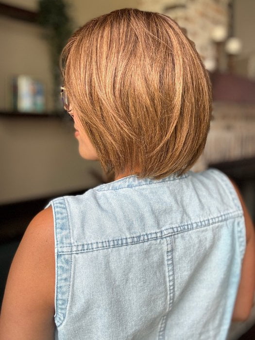 Brea wearing JADORE DELUXE by ELLEN WILLE in CHOCOLATE-ROOTED | Medium to Dark Brown base with Light Reddish Brown highlights and Dark Roots