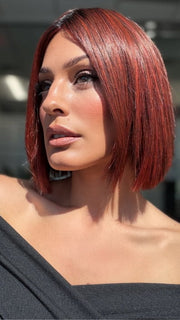 Roxie wearing CUTTING EDGE by GABOR in GF132SS SANGRIA | Intense Fiery Red with dark roots and blended highlights for dimension and depth