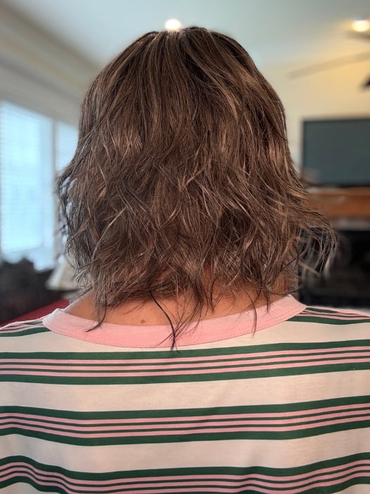 Eileen wearing TERRA by AMORE in BRONDE-R | Dark brown and natural medium blond tones are mixed together and shaded with medium dark brown roots for a realistic appearance.