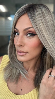 Roxie is wearing UNMATCHED 12" by RAQUEL WELCH in SS17/23 ICED LATTE MACCHIATO | Honey Blonde shaded with Cool Blonde with Dark Roots