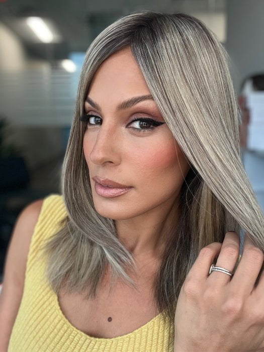 Roxie is wearing UNMATCHED 12" by RAQUEL WELCH in SS17/23 ICED LATTE MACCHIATO | Honey Blonde shaded with Cool Blonde with Dark Roots