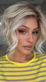 Roxie wearing LOS ANGELES by BELLETRESS in CRUSHED ALMOND BLONDE R | A soft Neutral Light Blonde with a Light and Medium Blended Root Color.