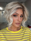 Roxie wearing LOS ANGELES by BELLETRESS in CRUSHED ALMOND BLONDE R | A soft Neutral Light Blonde with a Light and Medium Blended Root Color.