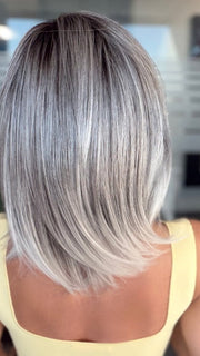 Roxie is wearing JUBILANT by GABOR in GL44-66SS SUGARED NICKEL | Deep charcoal base blends into multi-dimensional tones of medium grey with steely white highlights