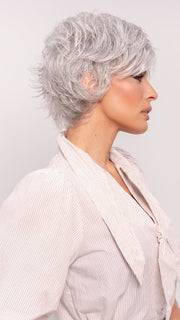 Roxie wearing VOLTAGE by RAQUEL WELCH in R56/60 SILVER MIST | Lightest Grey Evenly Blended with Pure White