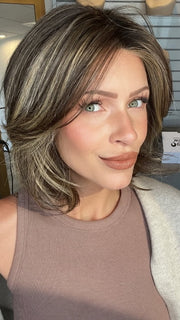 Madeline wearing FERRARI by BELLETRESS in CHOCOLATE BUTTERCREAM R | Medium and Dark Brown Rooted with a Blend of Medium Brown and Dark Blonde