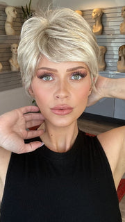 Madeline wearing SPARKLE by RAQUEL WELCH in R23S+ GLAZED VANILLA | Cool Platinum Blonde with Almost White Highlights