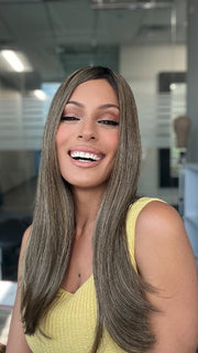 Roxie is wearing UNMATCHED 18" by RAQUEL WELCH in SS9/24 ICED CAFÉ LATTE | Dark Brown shaded with Golden Brown