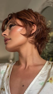 Roxie wearing ASHA by RENE OF PARIS in CAFE ROUGE R | A dimensional auburn copper blend with rich reddish-brown roots melting into warm copper highlights
